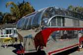 Restored Aero Flite vintage trailer has beautiful polished aluminum siding accented by painted red spear designs