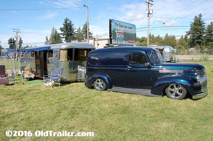 This vintage towing rig is a vintage chevy panel truck pulling a 1947 spartan-manor vintage trailer
