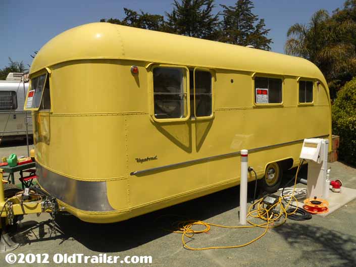 This 1950 Vagabond model 19 trailer has a lemon yellow paint job