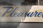 1955 Pleasure Craft vintage trailer has an original Pleasure Craft logo board in the window