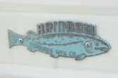 1956 Rainbow vintage trailer still has an original fish cast logo badge
