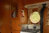 Gas wood stove and restored gas oven/stove unit in beautiful 1957 Airfloat Cruiser trailer