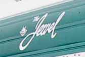 Jewel logo graphic on the front end of a 1957 Jewel vintage trailer