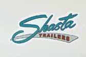 Vintage 1962 Shasta trailer has a very shrap blue reproduction logo decal on the side
