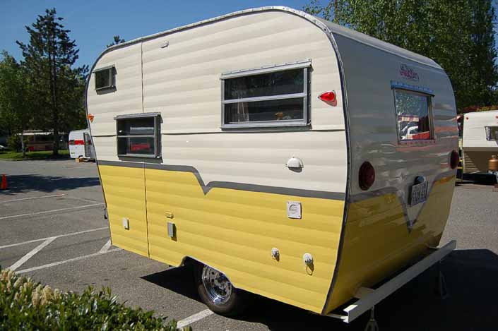 Great looking yellow and white vintage Aladdin Genie travel trailer