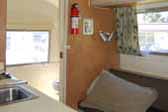 Photo of 1967 Airstream Caravel trailer interior, looking towards the bathroom