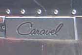 Cast aluminum Caravel logo plate on the side of a 1969 Airstream Caravel travel trailer