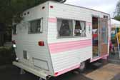 Rear view of pink and white 1969 Aladdin vintage trailer