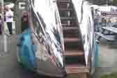 Picture of beautiful teak steps leading to upper deck of streamlined Decoliner Motorhome