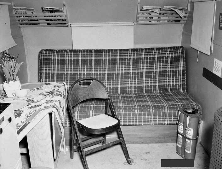 Government photo shows the interior of a 1940's model canned ham trailer supplied by the Government, at the Hanford Trailer Camp in Washington