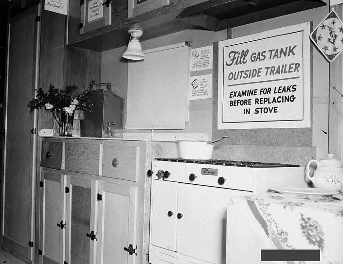 Government photo shows the kitchen area in a 1940's model canned ham trailer supplied by the Government, at Project Hanford Trailer City in Washington