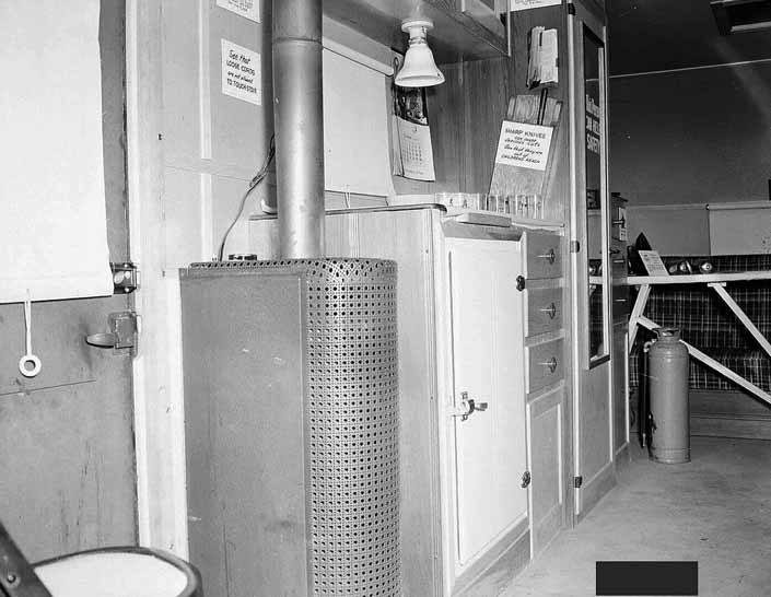 Government photo shows the interior in a 1940's model canned ham trailer supplied by the Government, at Project Hanford Trailer City in Washington