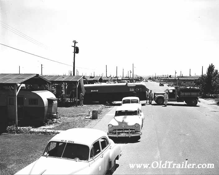 Government photo shows a newly arrived travel trailer being backed into place, at Project Hanford Trailer City in Washington