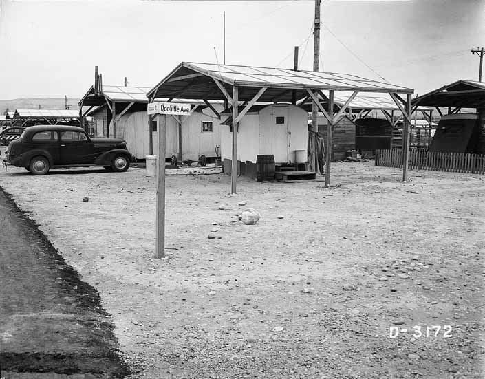 Government photo shows a collection of small vintage trailers from the 1940's, at the Project Hanford Trailer City in Washington