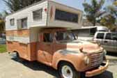 Classic Studebaker Pickup Truck with a Vintage Camper Shell mounted in the bed