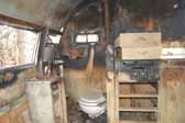 Vintage trailer storage yard has a Shasta trailer heavily damaged by an interior fire