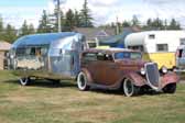 Picture of a chopped ford tudor sedan towing a rare 1936 bowlus vintage trailer