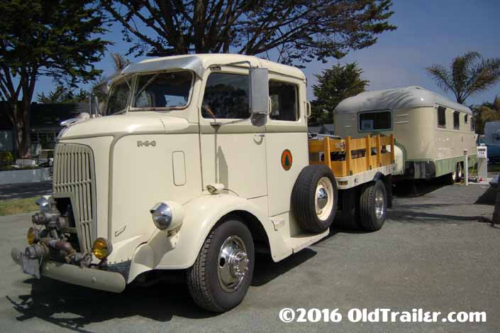 This vintage towing rig is a 1938 REO COE Stakebed Truck pulling a 1950 Westcraft Coronado Vintage Trailer