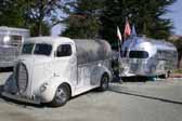 Photo shows a 1939 ford COE pickup truck towing a vintage clipper trailer