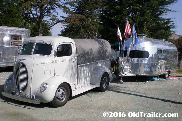 This vintage towing rig is a 1939 ford coe pickup truck pulling a vintage clipper trailer