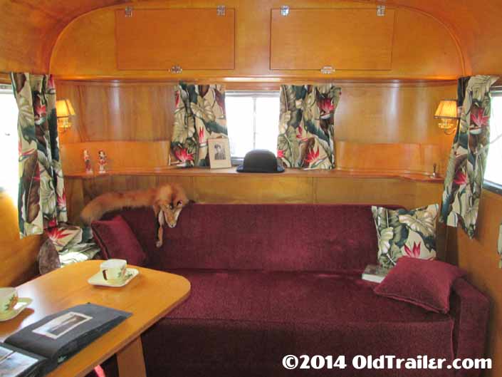 Restored cabinets in the front living room area of a 1948 Vagabond vintage trailer