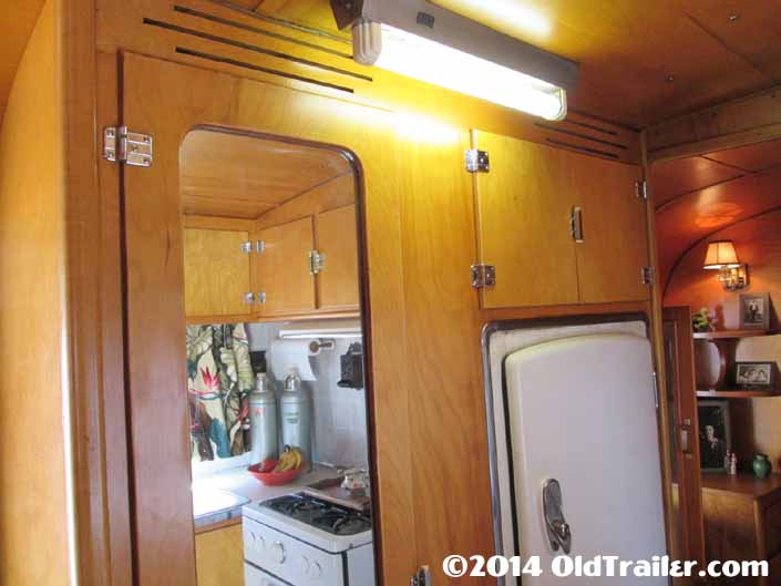 This vintage 1948 Vagabond trailer still has the original ceiling light fixture in the hallway