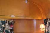 Photo of vintage 1948 vagabond trailer, showing front ceiling cabinets