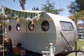 Skipper model 1949 vintage Airfloat travel trailer all setup for camping at Pismo Beach in California