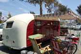 Picture of a 1949 vintage Vagabond trailer setup for camping at the Pismo Trailer Rally