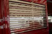 Picture of the iconic metal venetion blinds in a 1949 Vagabond trailer front door