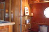 Beautifully re-finished wood cabinetry and paneling in a vintage 1950 Airfloat LandYacht trailert coach