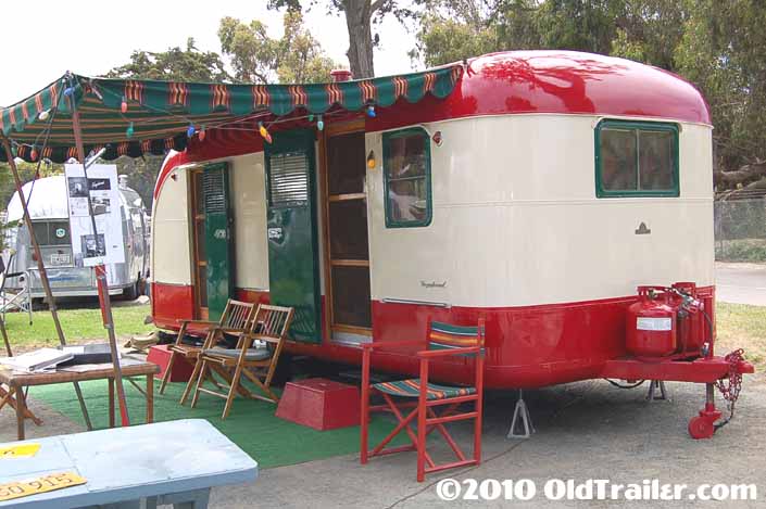 Dark green striped side awning on a 1950 vintage Vagabond trailer