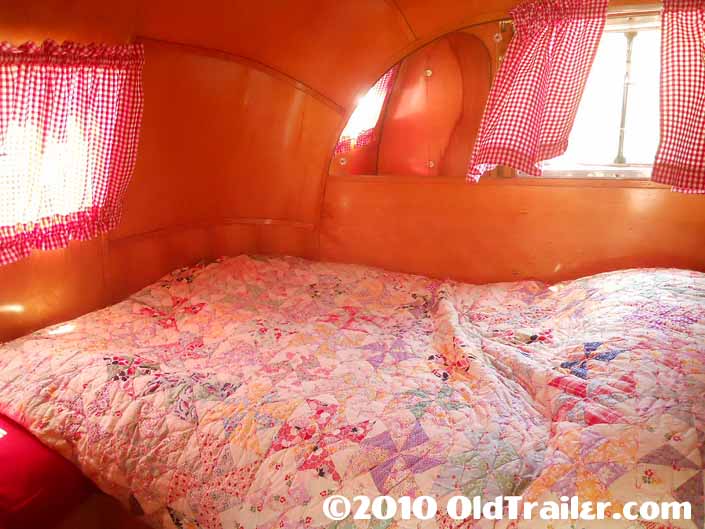 1950 Vagabond trailer with beautifully refinished paneling in the bedroom
