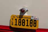 Picture of a restored Bargman license plate lamp on a 1950 Vagabond vintage trailer