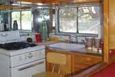 Photo of galley area and original gas stove in a 1950 Vagabond travel trailer