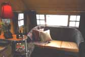 Photo of the living room area in the front of a 1950 Vagabond trailer