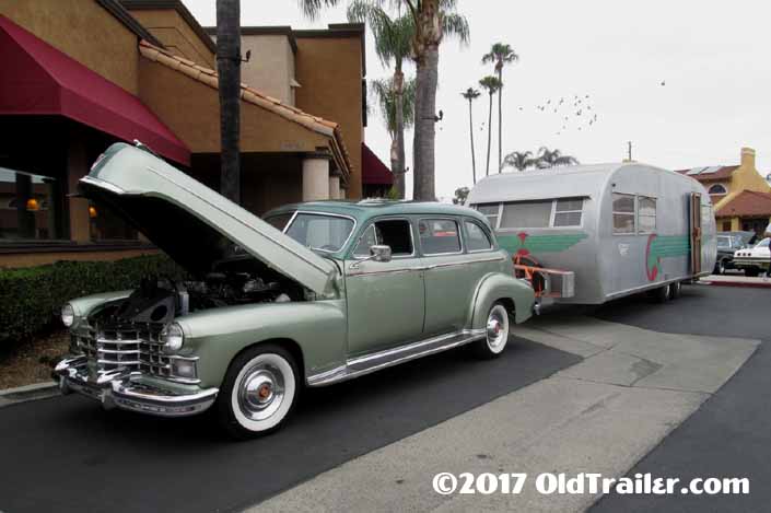 This vintage towing rig is a 1941 Cadillac limo pulling a 1951 spartanette tandem vintage trailer