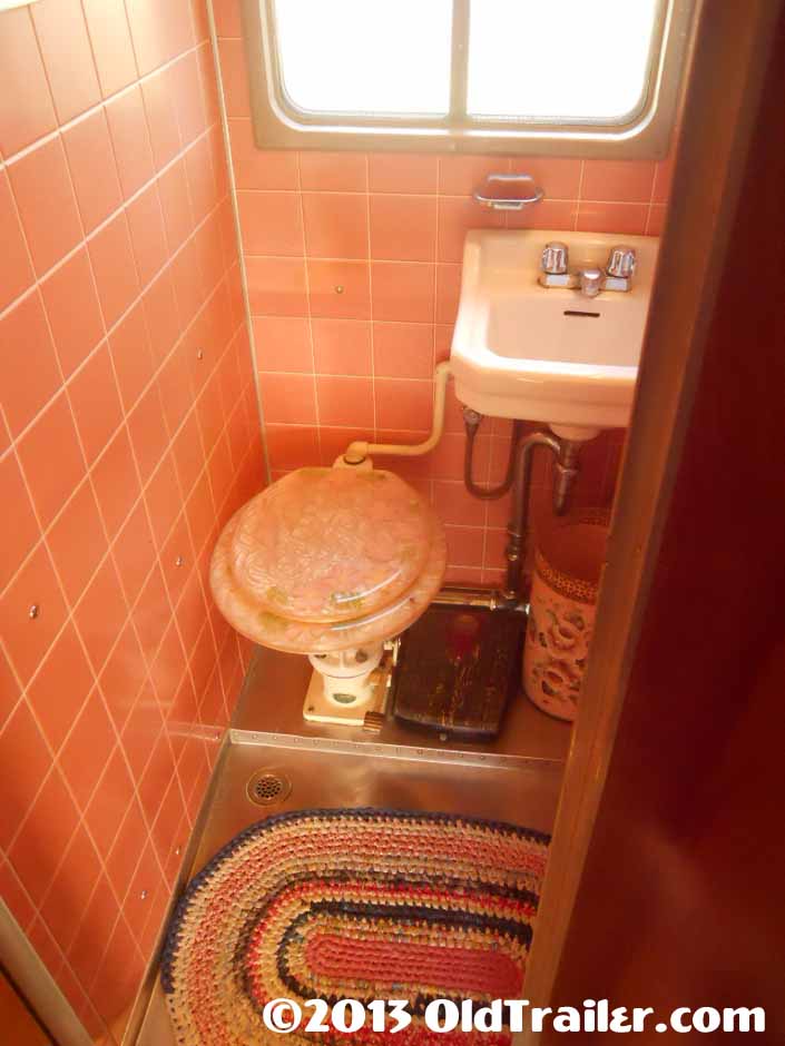This restored 1951 Vagabond trailer has original pink tile in the bathroom