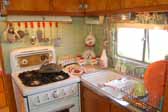 Picture of mint green walls in the kitchen area of a 1951 Vagabond trailer