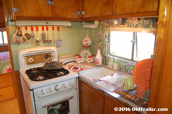 This 1951 Vagabond trailer has mint green tiles in the kitchen area