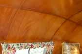 Photo shows beautiful curved ceiling panels in a 1951 Vagabond trailer bedroom