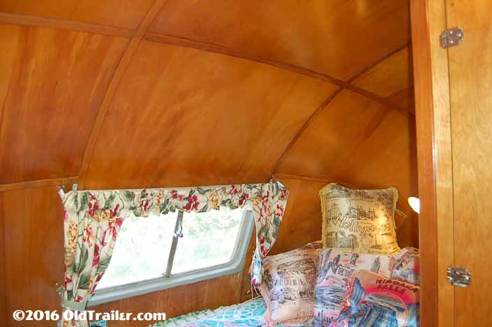 This 1951 Vagabond trailer has beautiful curved ceiling panels in the bedroom