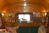 Picture of curio shelves in the front living room of a 1951 Vagabond trailer