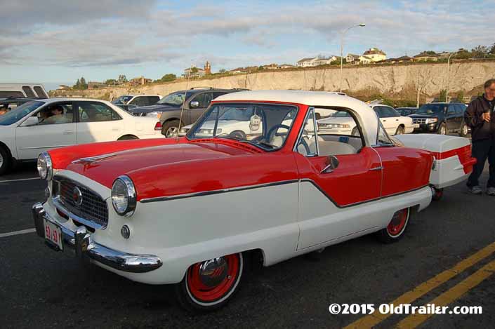 This vintage towing rig is a 1954 metropolitan pulling a vintage trailer