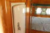 Beautifully restored galley with vintage Marvel fridge, in 1955 Aljoa Sportsman trailer