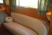 Awesome curved sofa unit in vintage 1955 Aljoa Sportsman travel trailer