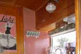 Picture of restored 1955 Aljoa Sportsman Travel Trailer kitchen countertop and wood cabinetry