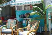 Beautiful 1955 Aljoa Trailer with restored Hawaiian bamboo upholstered arm chairs