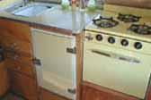 1955 Shasta Trailer with beautiful yellow countertop, fridge and Princess gas oven