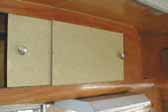 Picture of original laminate sliding cabinet doors in 1955 Shasta Trailer
